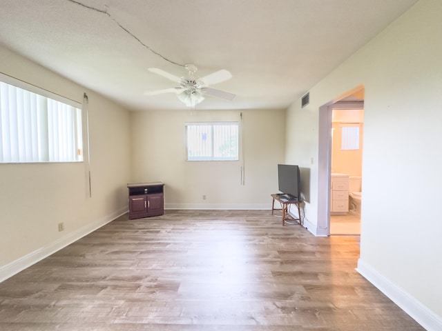 empty room featuring light hardwood / wood-style floors and ceiling fan