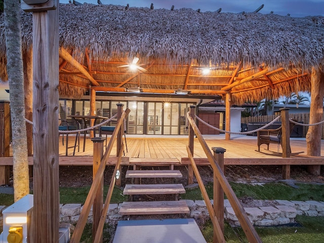 playground at dusk with a gazebo and a deck