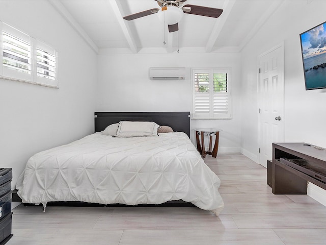 bedroom with ceiling fan, light wood-type flooring, beam ceiling, and a wall unit AC