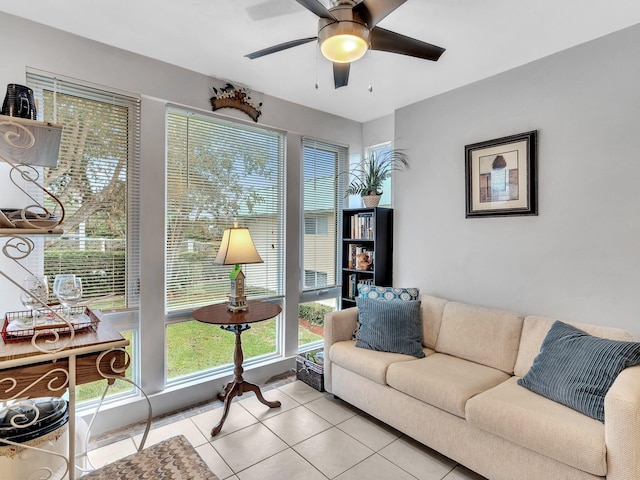 tiled living room with ceiling fan