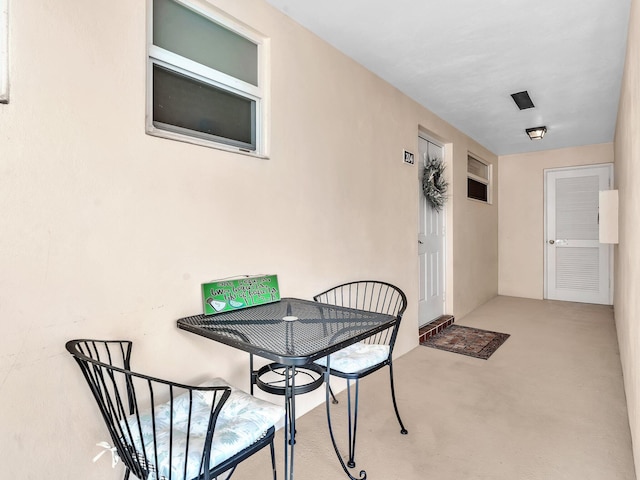 dining space featuring light colored carpet