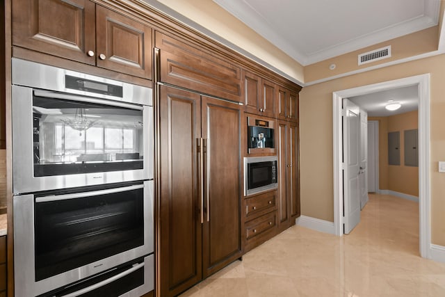 kitchen featuring ornamental molding, built in appliances, and electric panel