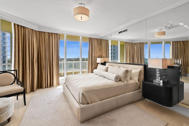 bedroom featuring crown molding and floor to ceiling windows