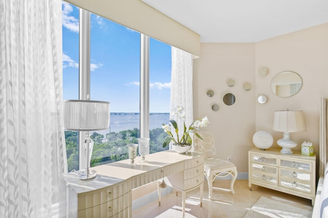 bathroom featuring a water view and plenty of natural light