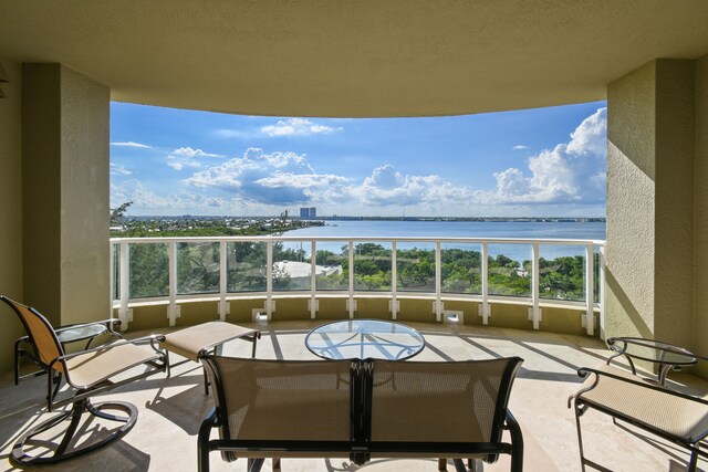 balcony featuring a water view