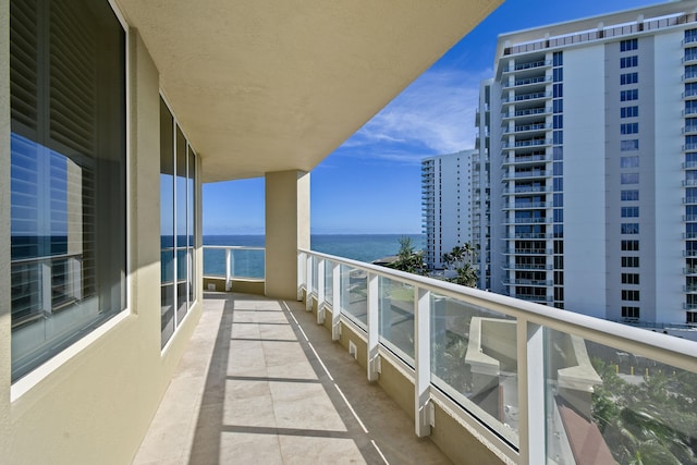 balcony featuring a water view