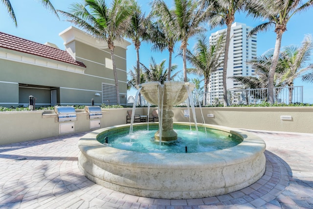 view of home's community with an outdoor kitchen