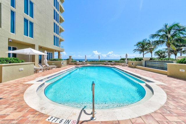 view of swimming pool featuring a patio area