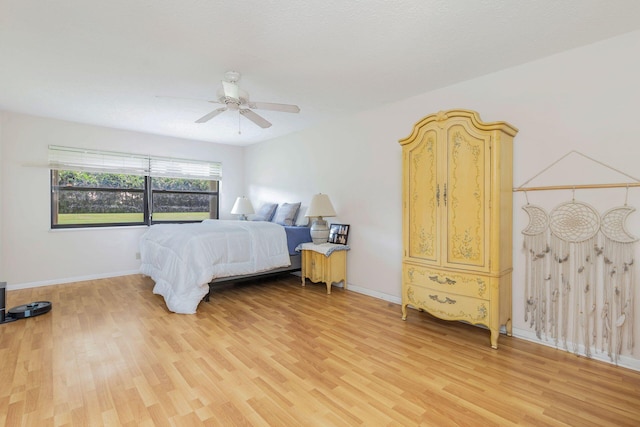 bedroom with ceiling fan and light hardwood / wood-style flooring