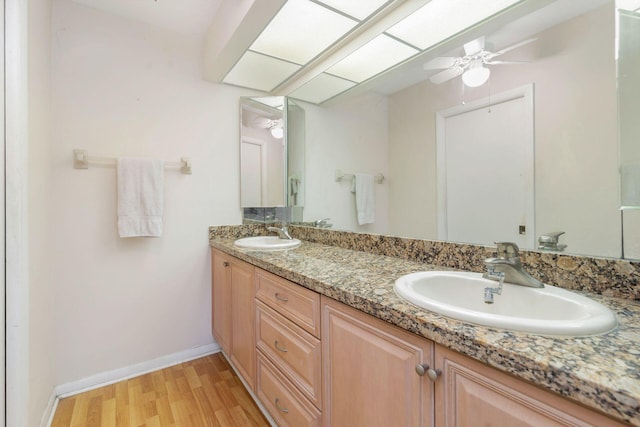 bathroom featuring vanity and wood-type flooring