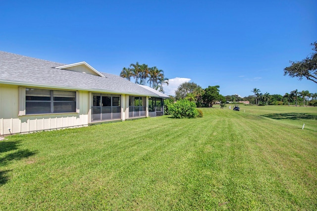 view of yard featuring a sunroom