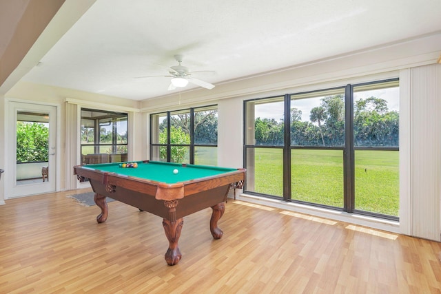 game room featuring billiards, light wood-type flooring, and ceiling fan