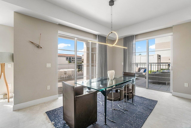 dining space with light tile patterned floors and a wealth of natural light