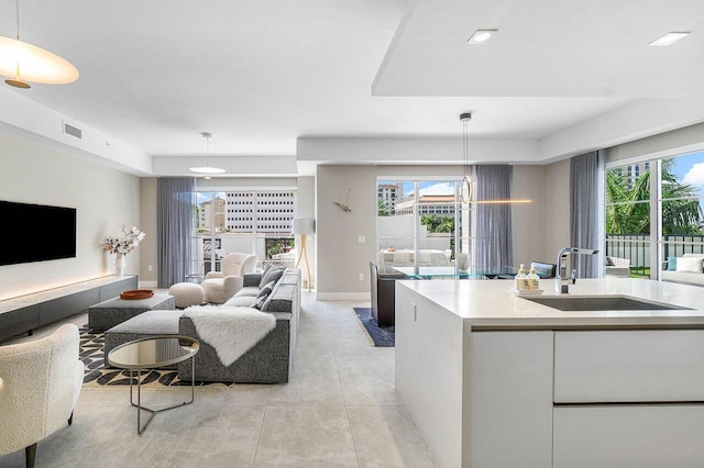 living room with light tile patterned floors and sink