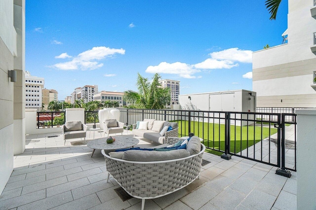 view of patio with a balcony and outdoor lounge area