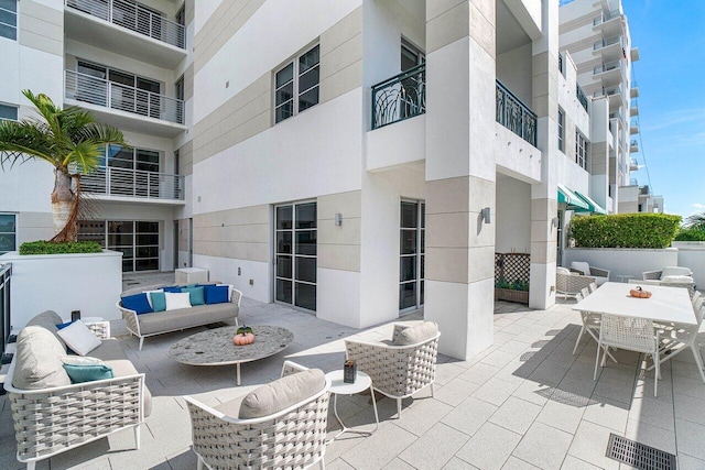 view of patio / terrace featuring a balcony and an outdoor living space