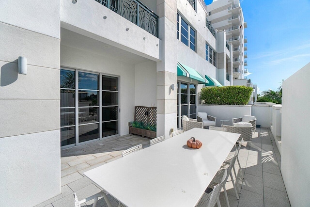 view of patio with a balcony