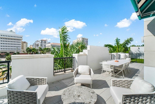 view of patio featuring a balcony