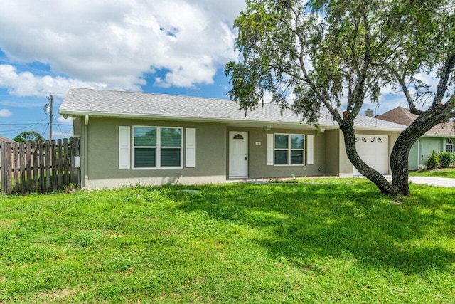 single story home with a front yard and a garage