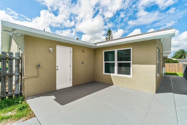 property entrance with a patio area