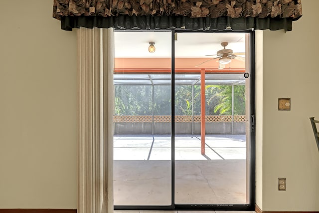 doorway featuring ceiling fan