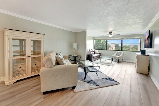 living room featuring ceiling fan, a textured ceiling, light wood-type flooring, and crown molding