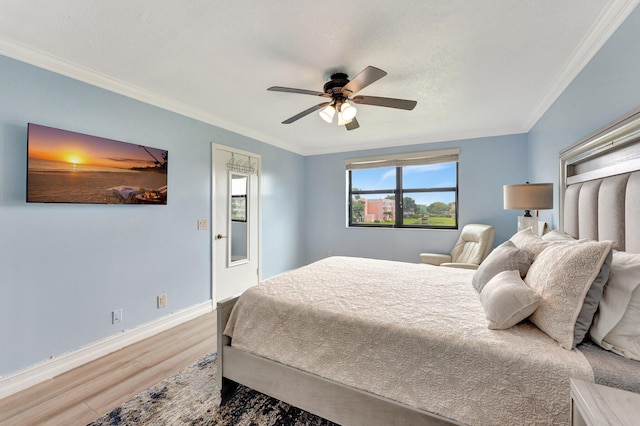 bedroom featuring wood-type flooring, ceiling fan, and crown molding