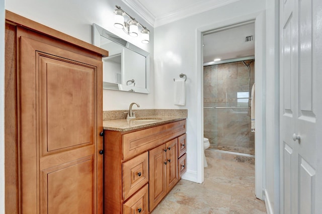 bathroom featuring ornamental molding, vanity, toilet, and a shower with door