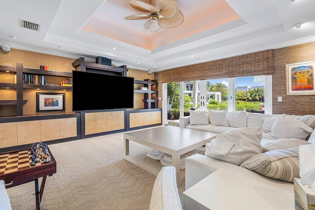 interior space with crown molding, a tray ceiling, ceiling fan, and french doors