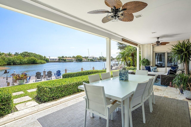 view of patio / terrace with a water view, ceiling fan, and outdoor lounge area