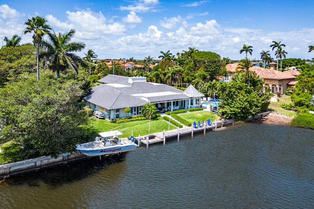 birds eye view of property featuring a water view