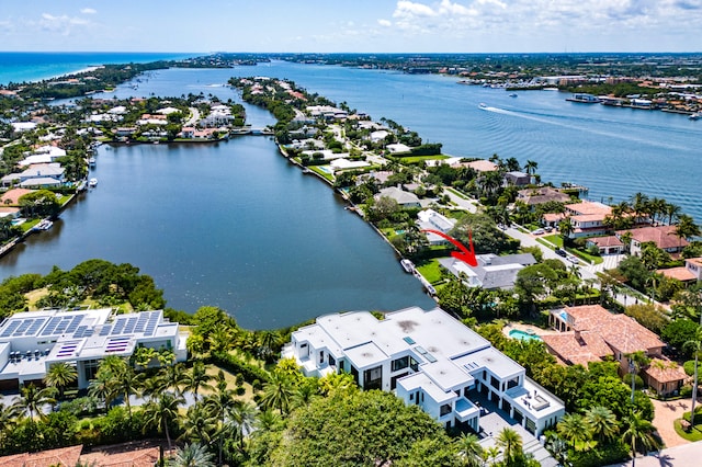 birds eye view of property with a water view