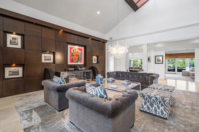 living room with high vaulted ceiling and a chandelier