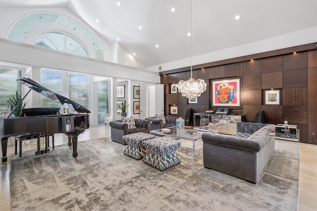 living room featuring high vaulted ceiling and a notable chandelier