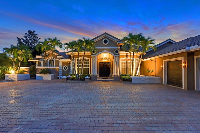 view of front of home with a garage