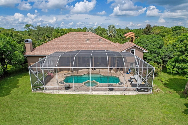 back of house featuring a lanai, a patio, and a lawn