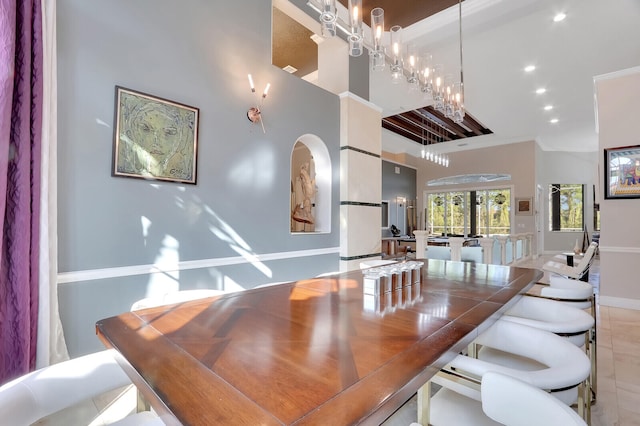 dining space with a high ceiling and light tile patterned flooring