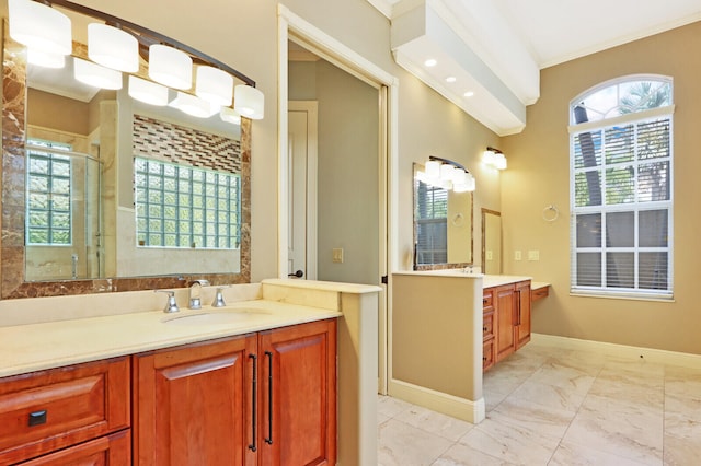 bathroom featuring walk in shower, vanity, and crown molding