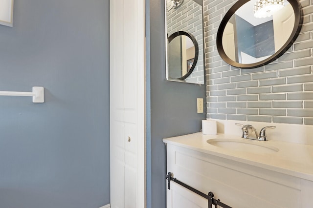 bathroom with vanity and backsplash