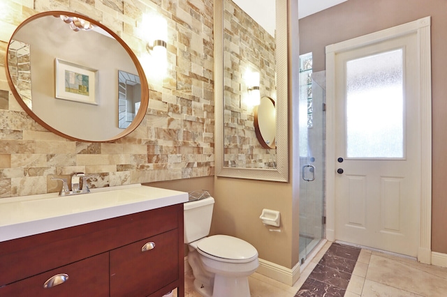 bathroom featuring vanity, toilet, tile patterned floors, and an enclosed shower