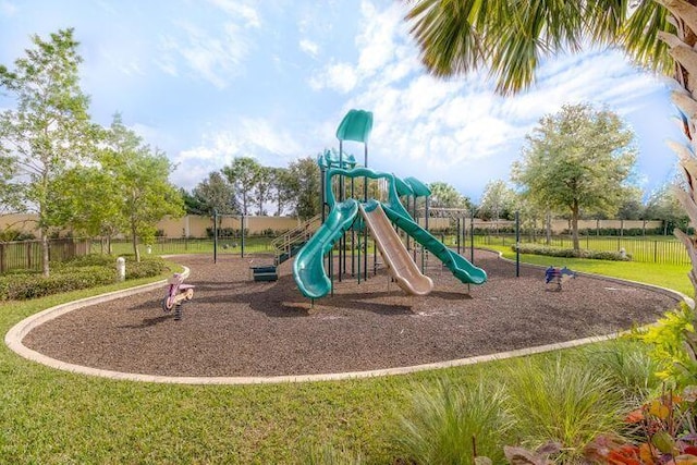 view of playground with a lawn