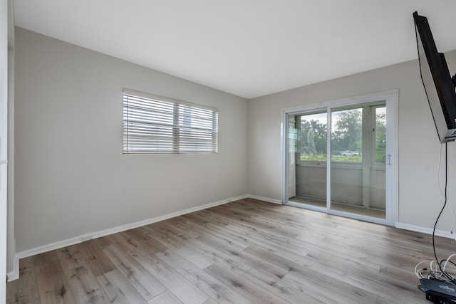 unfurnished room featuring light wood-type flooring