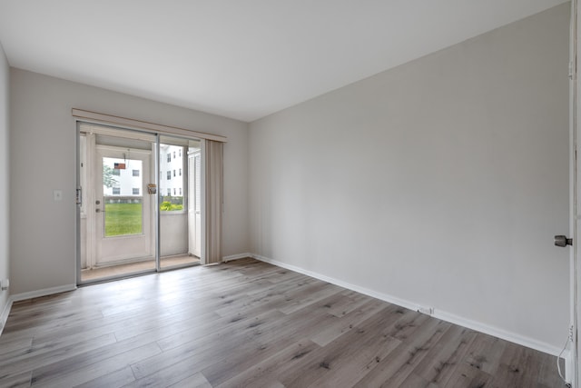 unfurnished room featuring light hardwood / wood-style floors