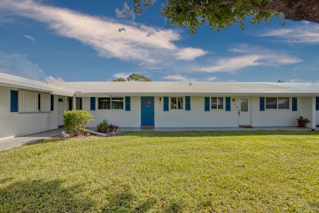 ranch-style house with a front lawn