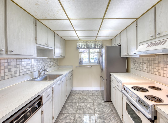 kitchen featuring light tile patterned floors, sink, dishwasher, and tasteful backsplash