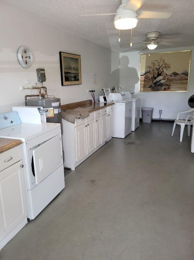 laundry area featuring separate washer and dryer, water heater, a textured ceiling, and ceiling fan