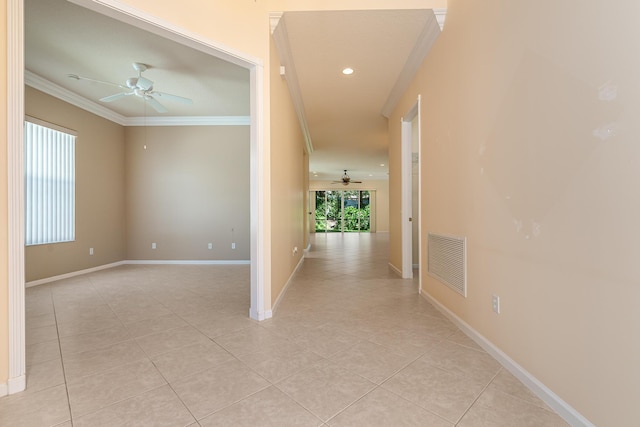 hall with light tile patterned floors, crown molding, visible vents, baseboards, and recessed lighting