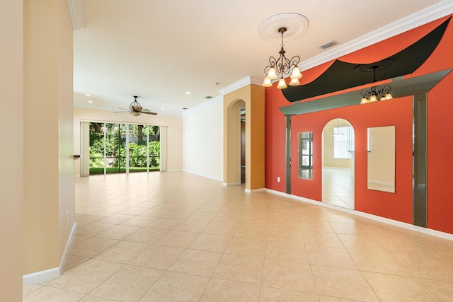 spare room with arched walkways, light tile patterned floors, ornamental molding, ceiling fan with notable chandelier, and visible vents
