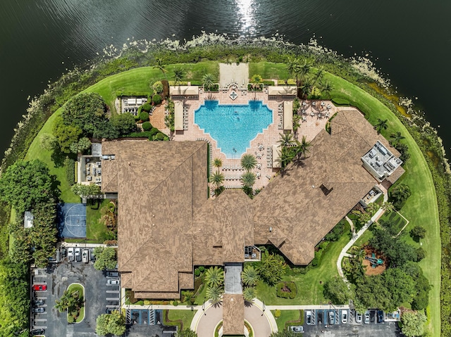 birds eye view of property with a water view