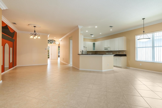 interior space featuring light tile patterned flooring, dark countertops, crown molding, and freestanding refrigerator